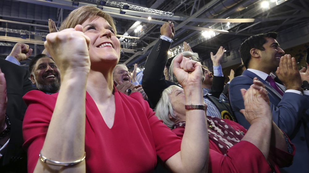 The SNP leader Nicola Sturgeon celebrates victory after the party made an unprecedented clean sweep of seats in Scotland  [AP]
