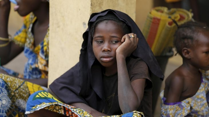 A girl who was freed by the Nigerian army from Boko Haram militants in the Sambisa forest looks on at the Malkohi camp for internally displaced people in Yola