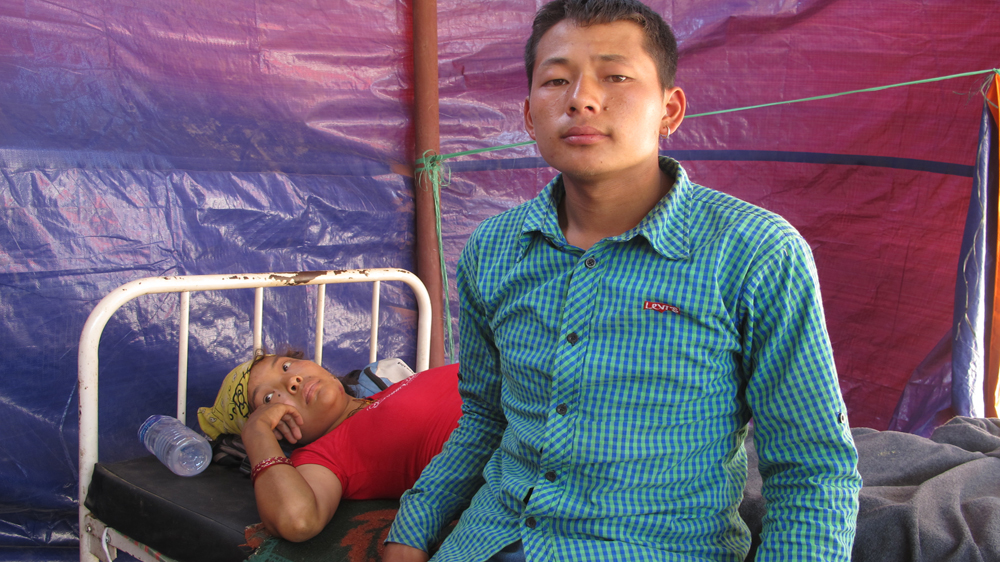 Jeet Badhadui Tamang, 21, with his wife Laxmi who suffered a fractured pelvis and lost her baby [Annette Ekin/Al Jazeera] 