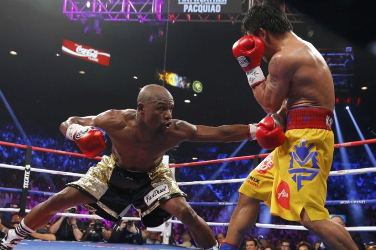 Mayweather stays low against Pacquiao in the eighth round during their title fight in Las Vegas [REUTERS]