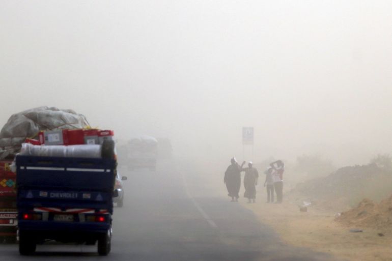 Sandstorm over a highway. Minya Governate, Egypt