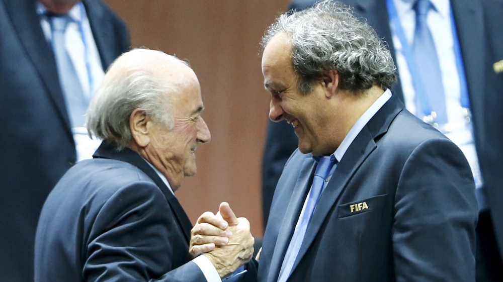 Platini (R) had asked Blatter to step down following the Zurich arrests [Reuters]