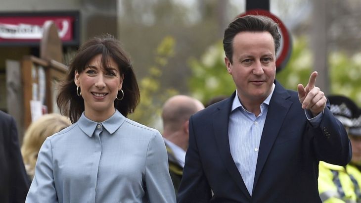 Britain''s Prime Minister David Cameron arrives with his wife Samantha to vote in Spelsbury