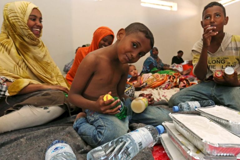 Yemeni children wait to eat donated food at a temporary shelter after fleeing violence with their families in Yemen, at the port town Bosasso in Somalia''s Puntland