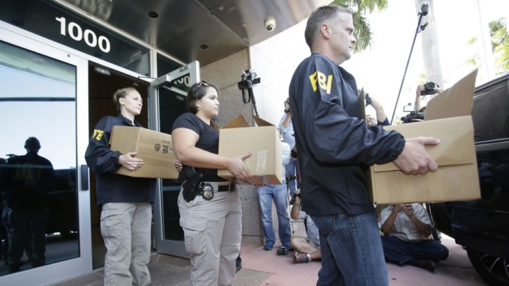 Federal agents carry out boxes of evidence taken from the headquarters of the Confederation of North, Central America and Caribbean Association Football (CONCACAF,) Wednesday, May 27, 2015, in Miami