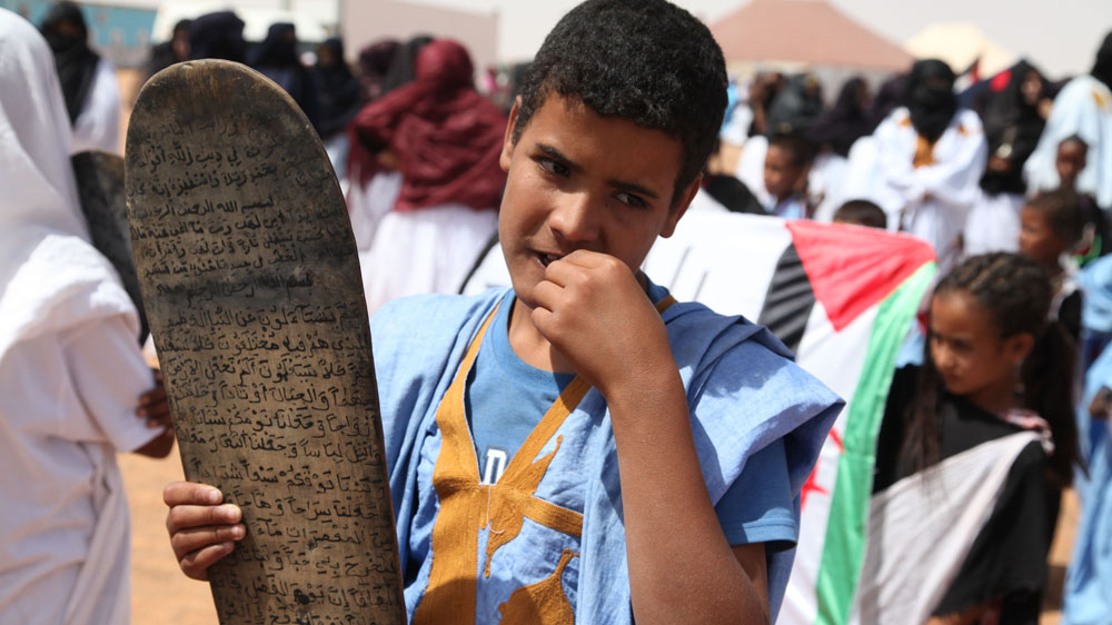 A young boy marches for a free Western Sahara at the FiSahara film festival [Hannah McNeish/Al Jazeera]