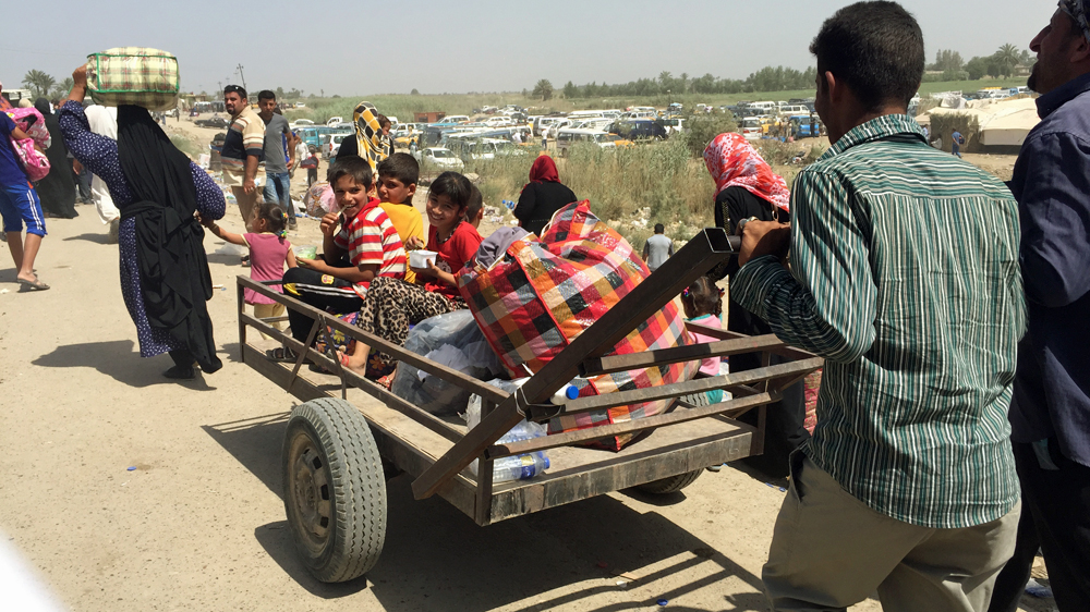 Many civilians fleeing Ramadi spend their days on the road waiting for permission to enter Baghdad [Zeina Khodr/Al Jazeera]