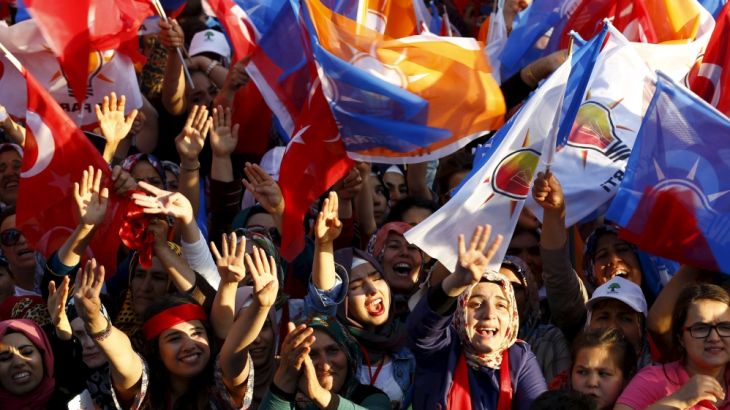 Supporters of ruling AK Party cheer as they listen to Prime Minister Davutoglu during an election rally for Turkey''s June 7 parliamentary election, in Kahramanmaras, Turkey