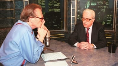 Tariq Aziz is interviewed by Larry King on Larry King Live in New York (1997) [AP]