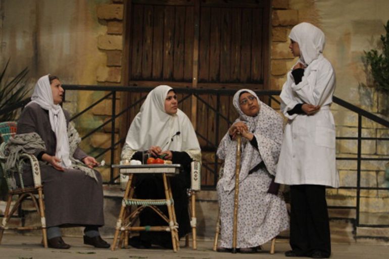 Palestinian women perform in a play on stage in Gaza City in 2012 [AFP]