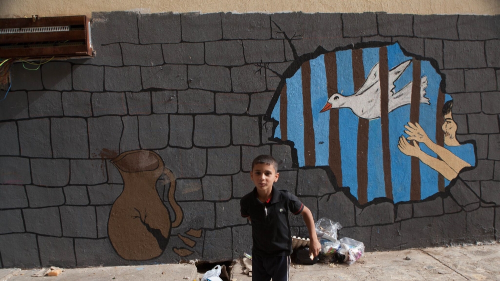 The designs on the camp walls are a testament to the children's experiences as refugees and their shared memories of Syria [Andrea DiCenzo/Al Jazeera]
