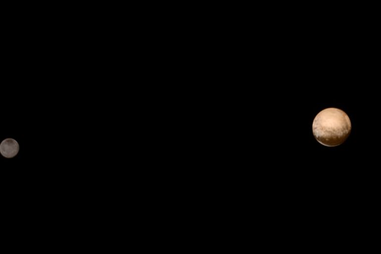 Pluto and its moon Charon are pictured from about 6 million kilometers in this NASA handout photo