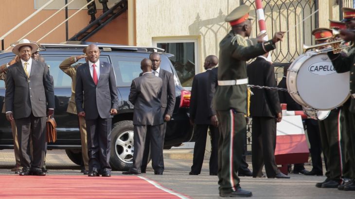 President of Uganda Yoweri Museveni, left, is welcomed by the President of Burundi