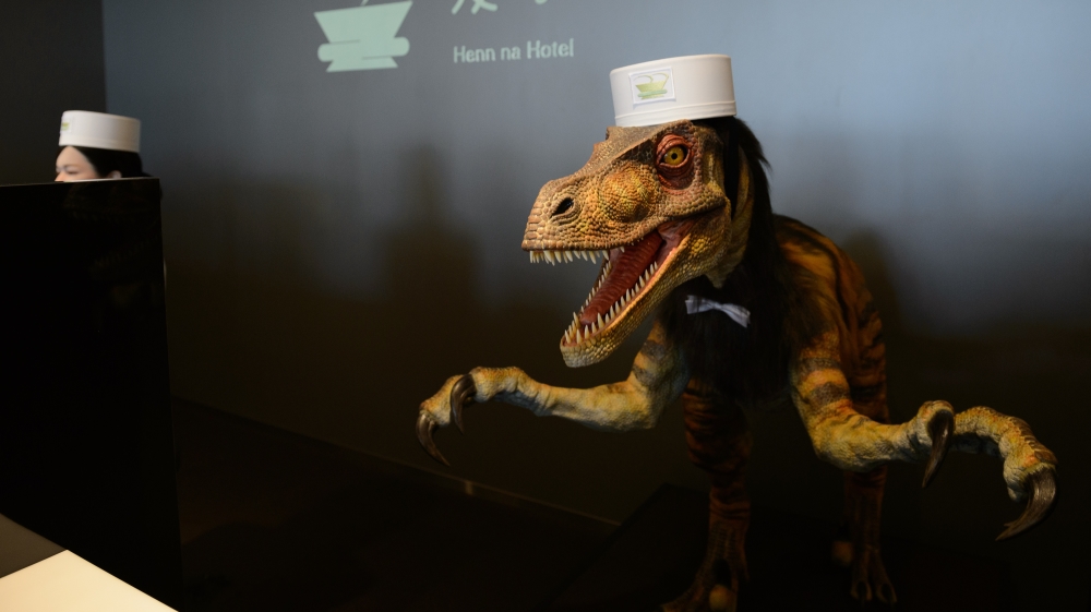 Staff include a dinosaur-shaped robot receptionist [Getty]