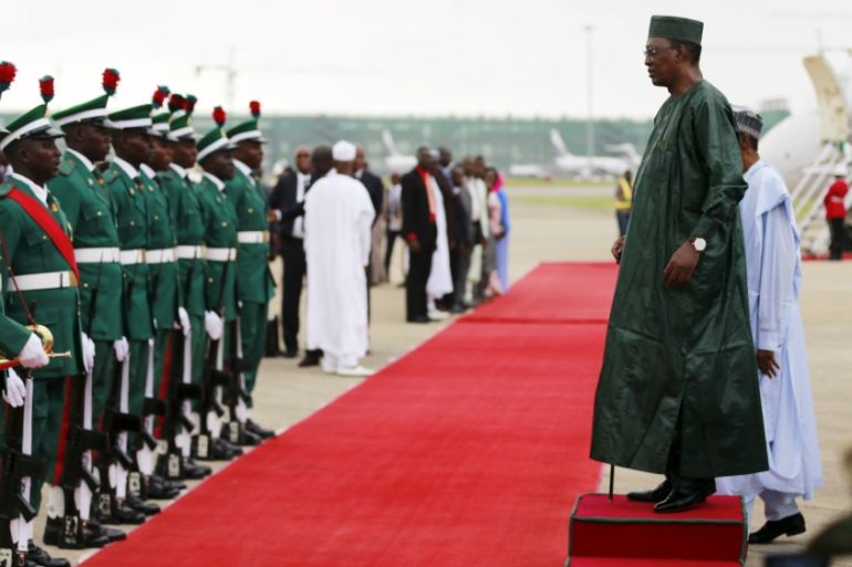 Chad's President Idriss Deby and his Nigerian counterpart Muhammadu Buhari inspect guard of honour in Abuja