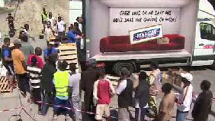 Calais migrant crisis: French charities hand out food