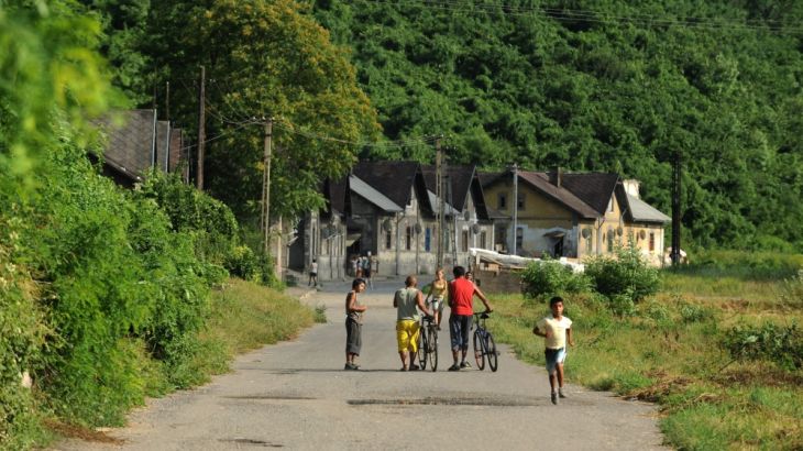 FILE – In this July 24, 2010 file photo People walk in a street in the Hetes borough of Ozd, 153 k
