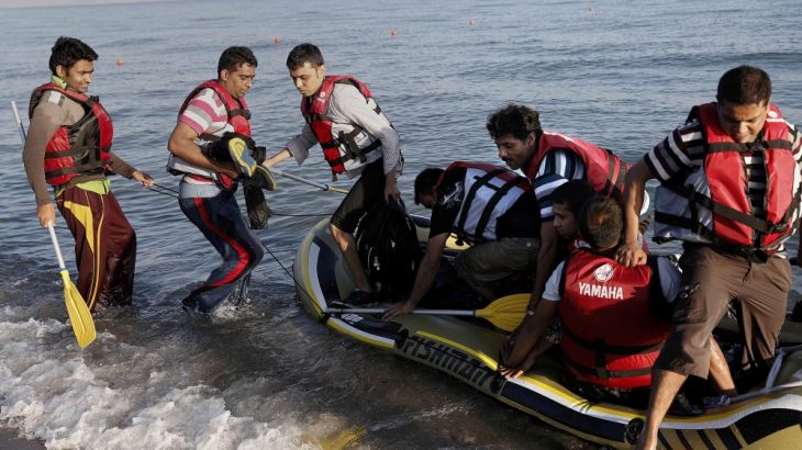 Migrants from Pakistan arrive on a dinghy on the Greek island of Kos