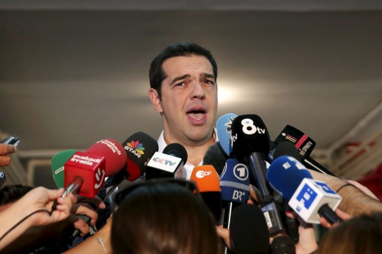 Former Greek PM and leader of leftist Syriza party Tsipras speaks to journalists after he voted for the general election at a polling station in Athens