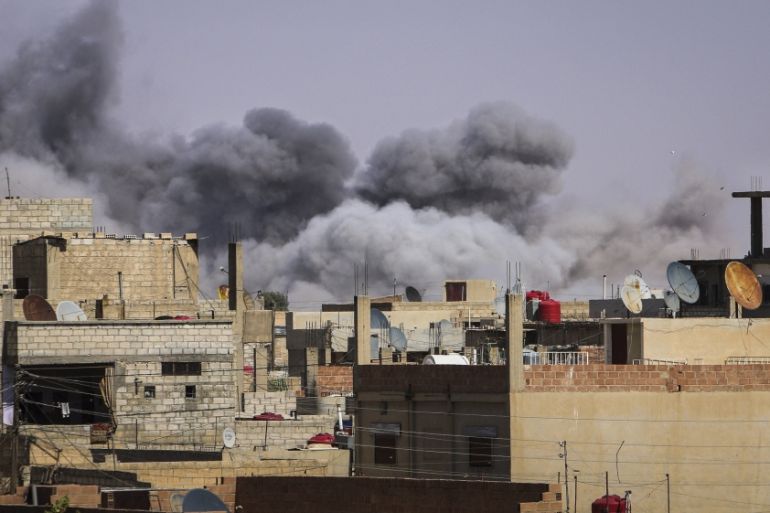 Smoke rises from what activists said were airstrikes in Hasaka city, Syria