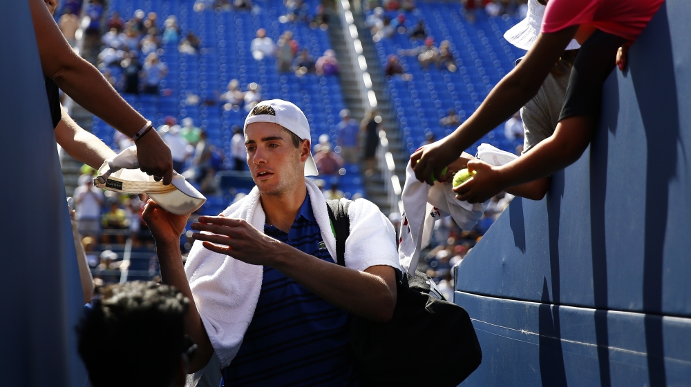 Isner stands between Federer and a place in the quarter-finals [AP]