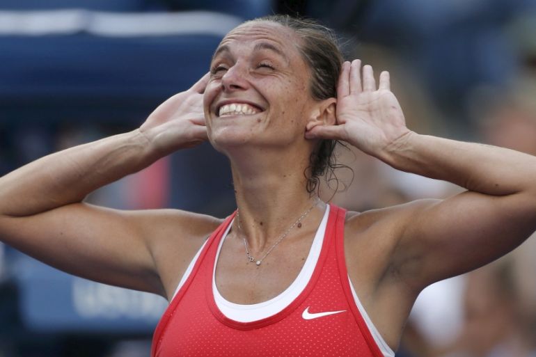 Vinci of Italy celebrates with the crowd after defeating Williams of the U.S. in their women''s singles semi-final match at the U.S. Open Championships tennis tournament in New York
