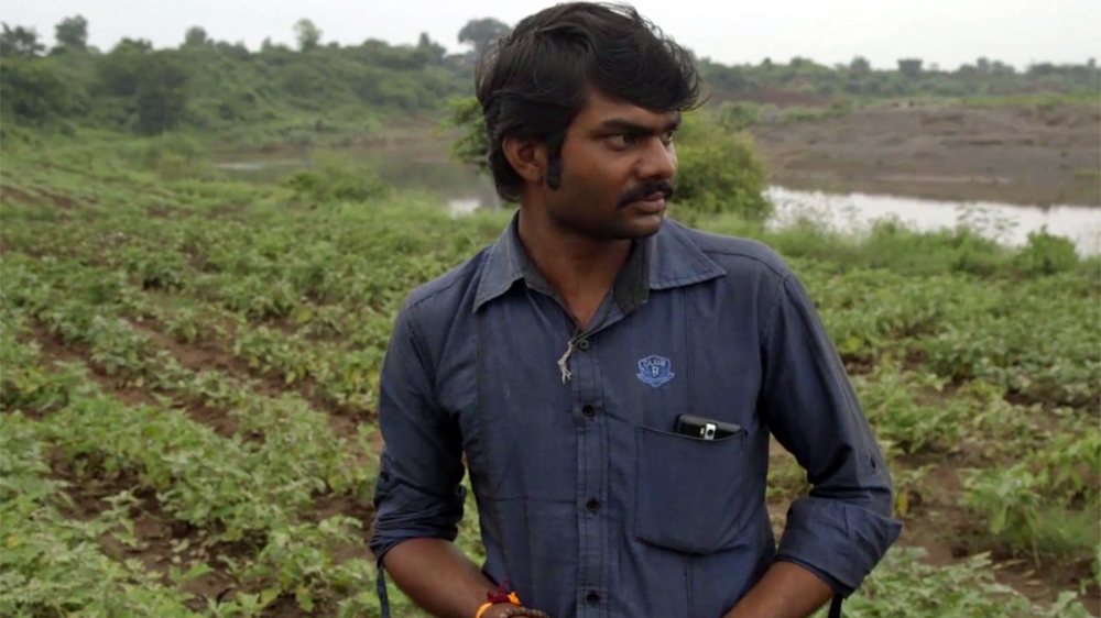 Shubham Kitukale at his farm in rural India [Dan McKinney/Al Jazeera]