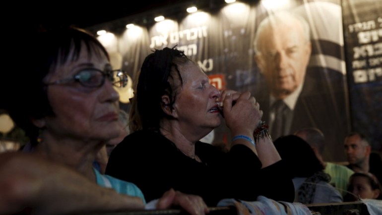 Israelis take part in a rally commemorating the 20th anniversary of the assassination of late prime minister Yitzhak Rabin in Tel Aviv Israel