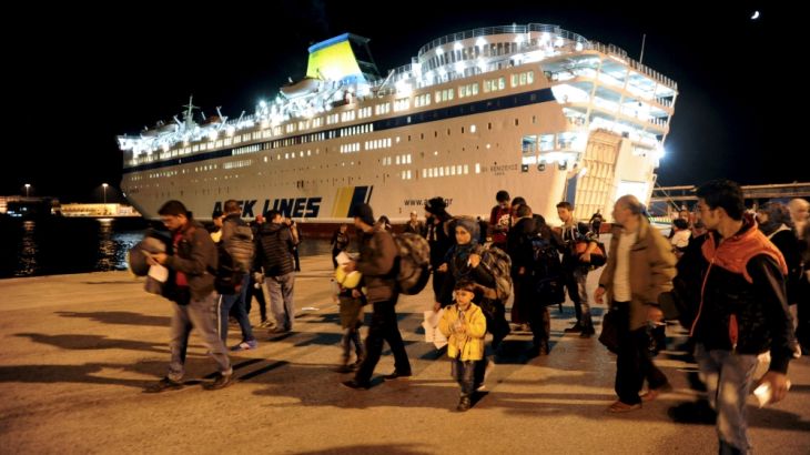 Refugees and migrants disembark the Eleftherios Venizelos passenger ship at the port of Piraeus