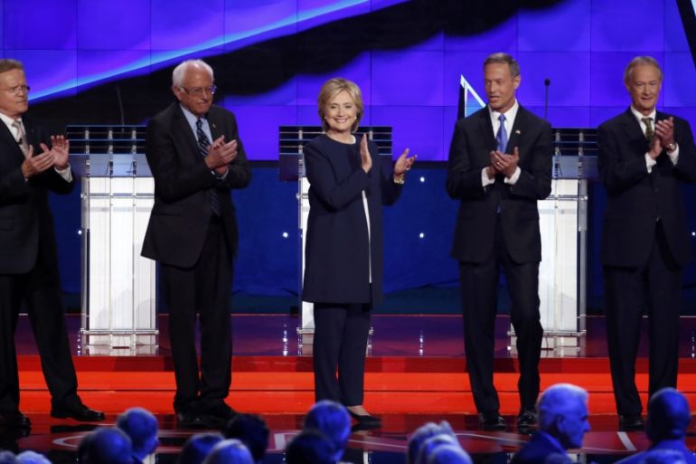 Democratic U.S. presidential candidates e applaud after singer Sheryl Crow sang the U.S. National Antthem before the first official Democratic candidates debate of t