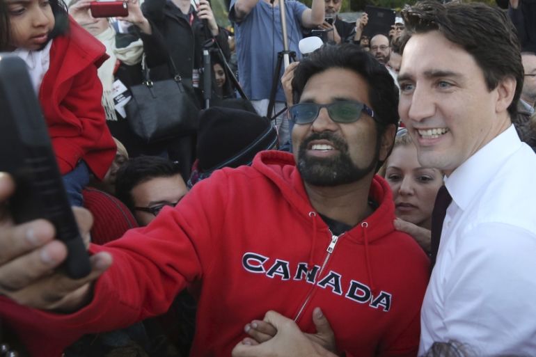 Liberal leader Trudeau poses for a selfie during a campaign rally in Ajax