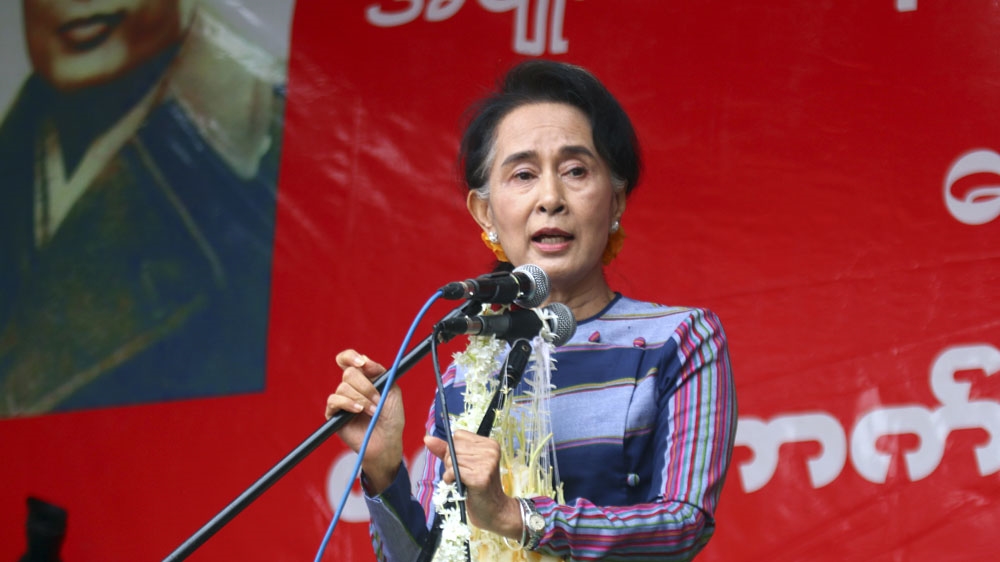  Myanmar opposition leader Aung San Suu Kyi speaks during her 'Election Awareness Tour' in Ho-Pong Township, southern Shan State [File: Khin Maung Win/AP] 