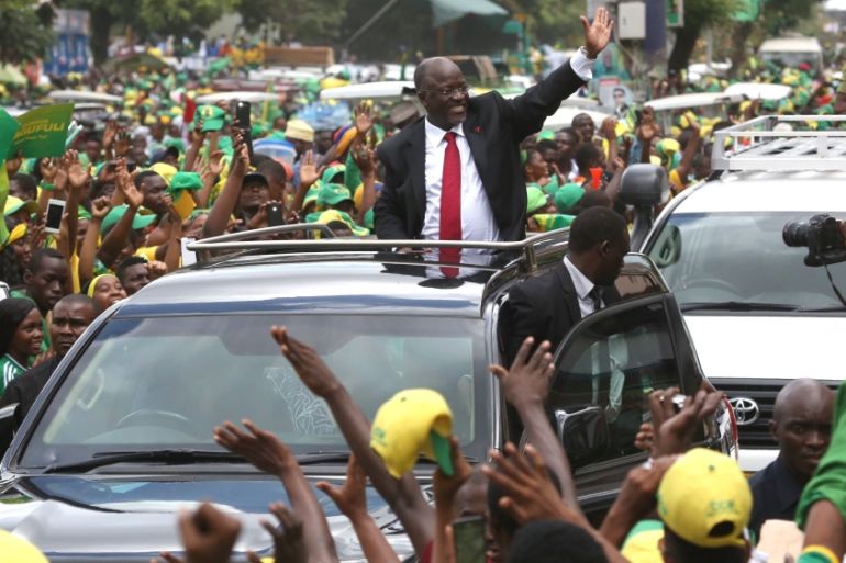 Tanzania''s President elect Magufuli salutes members of the ruling CCM as he arrives at the party''s sub-head office on Lumumba road in Dar es Salaam