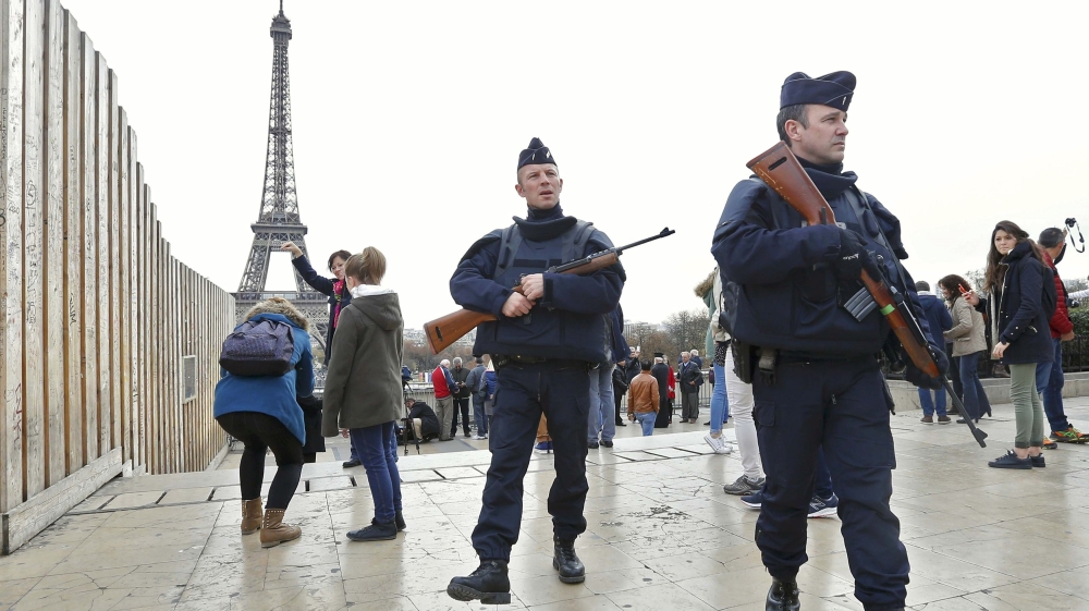 Police patrol near the Eiffel Tower the day after a series of deadly attacks in Paris [Reuters]