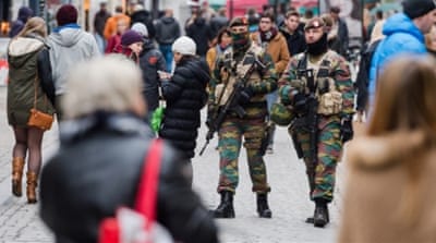 Soldiers from the Belgian army patrol in the picturesque Grand Place in Brussels [AP]