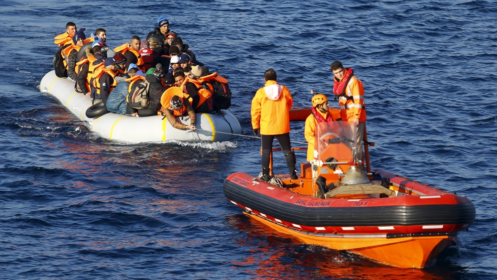 The Turkish Coast Guard tows refugees and migrants in a dinghy [Umit Bektas/Reuters]