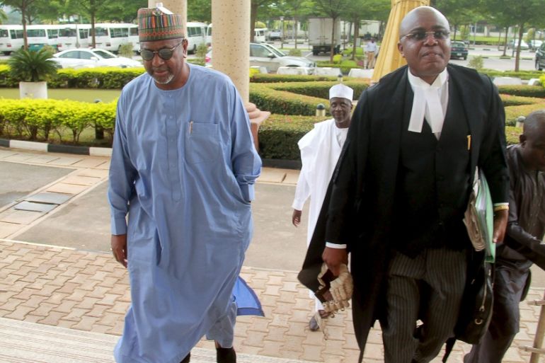 Former National Security Adviser Sambo Dasuki arrives with one of his counsels Ahmed Raji at the Federal High Court in Abuja