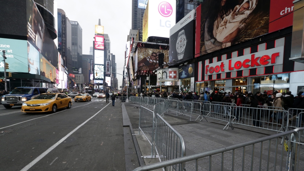 Barricades are seen lining the streets of Times Square the day before New Year's Eve in New York [EPA]
