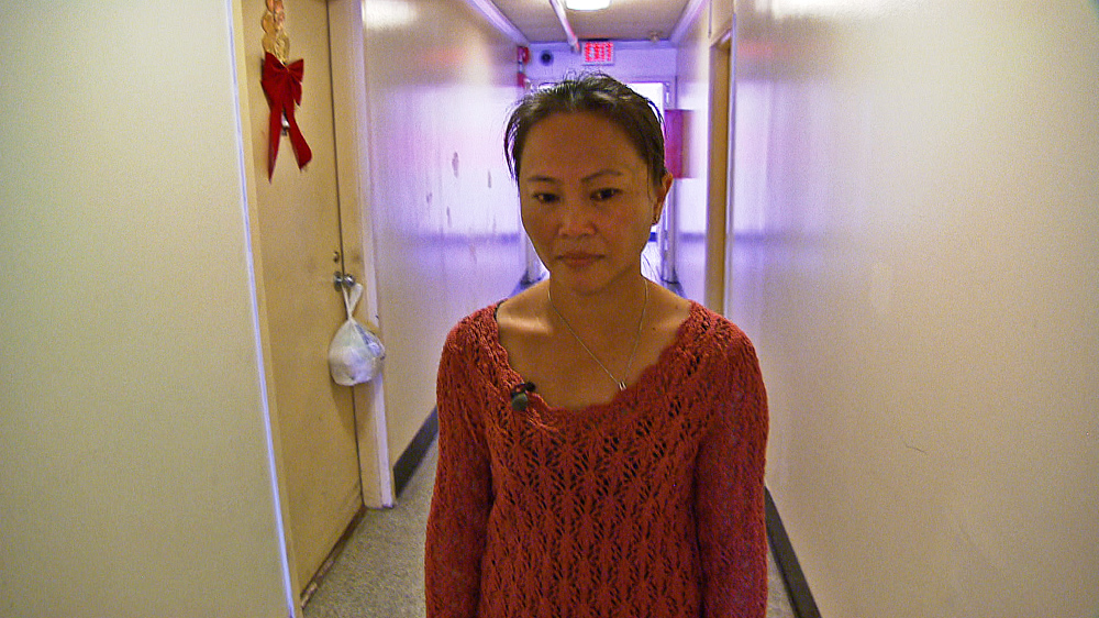 Jenny Tang is a single mother living in Washington, DC's Chinatown where luxury development projects are forcing residents to leave [Gabriel Elizondo/Al Jazeera]