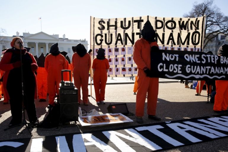 Protesters in orange jumpsuits from Amnesty International USA and other organizations rally outside the White House to demand the closure of the U.S. prison at Guantanamo Bay, in Washington