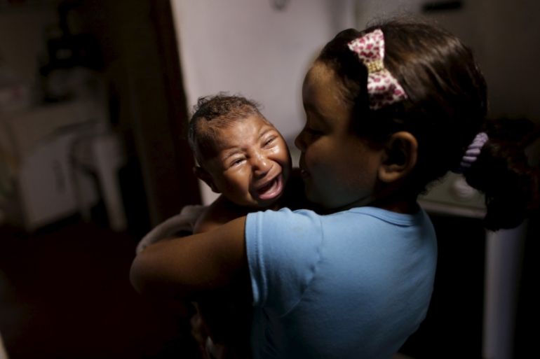 Camile Vitoria embraces her brother Matheus, who has microcephaly, in Recife, Brazil