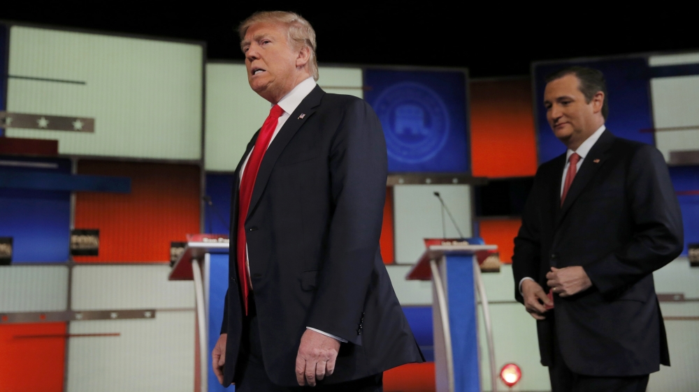 Cruz [right] defeated billionaire businessman Donald Trump, the perceived frontrunner in the US state of Iowa [Reuters]