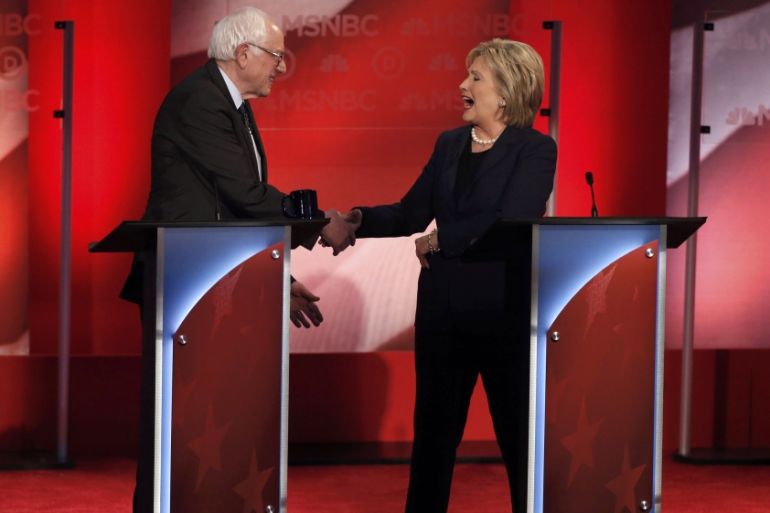 Democratic U.S. presidential candidate Senator Bernie Sanders and former Secretary of State Clinton shake hands at the conclusion of the Democratic presidential candidates debate