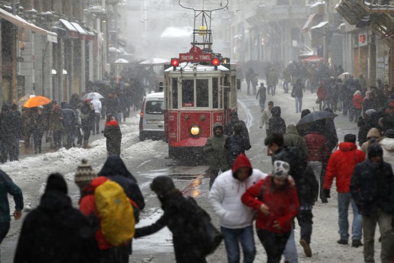 People walk in city''s busy Istiklal Street in Istanbul [AP]