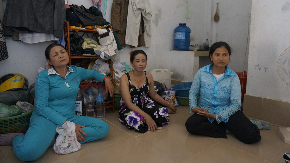 Cambodian garment wokers Kong Sak, Louk Savan, Srey Mao [Nathan A Thompson/Al Jazeera]