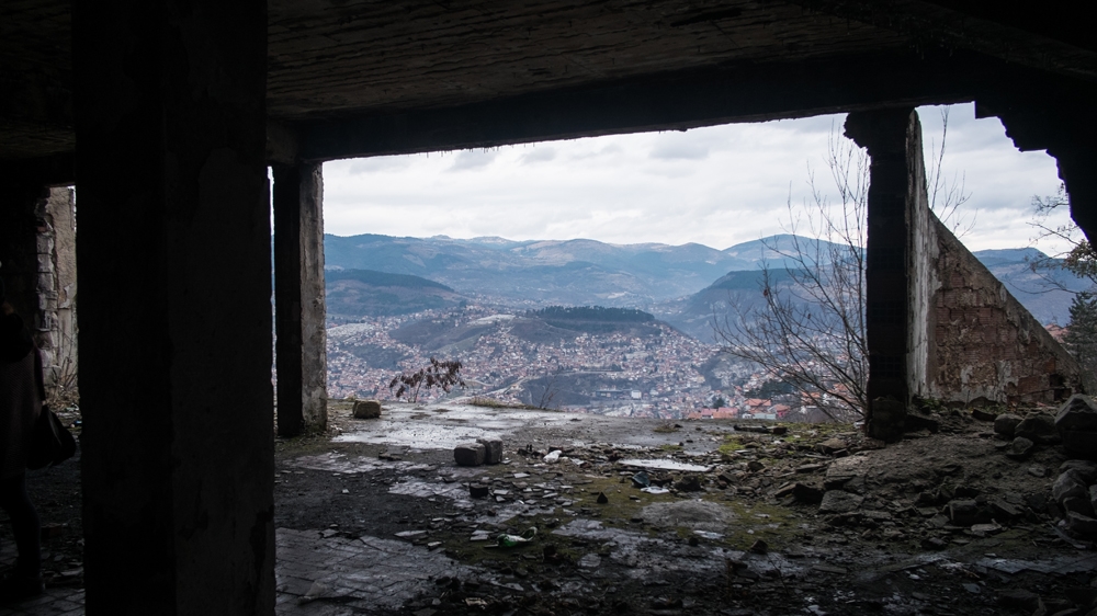 
On top of the hills surrounding Sarajevo were damaged buildings from which Serbian snipers would shoot into the besieged city [Arianna Pagani/Al Jazeera]
