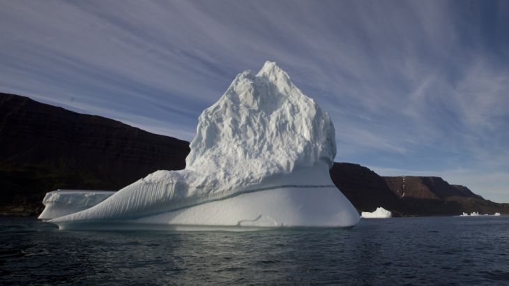 In this July 21, 2011 file photo, an iceberg floats in the sea near Qeqertarsuaq, Disko Island, Greenland.