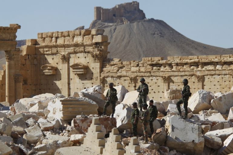 File photo of Syrian army soldiers standing on the ruins of the Temple of Bel in the historic city of Palmyra
