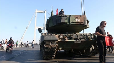 Turkish police and anti-coup demonstrators gather around a military tank on the Bosphorus Bridge after the failed coup attempt, in Istanbul on July 16 [EPA]