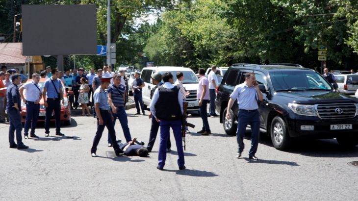 Police officers detain man after attack in centre of Almaty